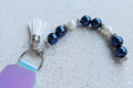 Beaded Keyring – Navy Blue Pearl & Opalescent White Bead with White Tassel